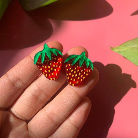 Set of earrings in the image of two red strawberries.