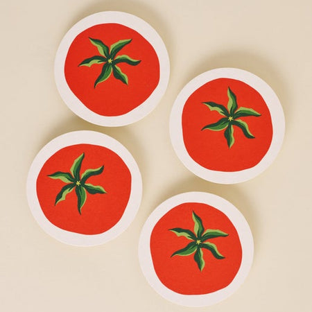 Circle coasters in the image of red tomatoes with green vine leaves.