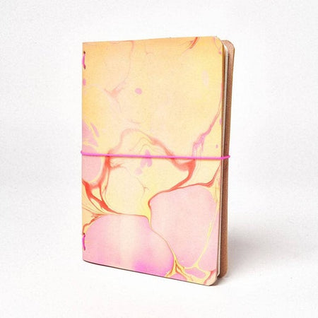 Leather notebook with multicolored marble swirl design. 